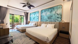 A modern hotel room with two beds, a desk, and a ceiling fan. - Dawn Boutique Luangprabang Hotel (Luang Prabang)