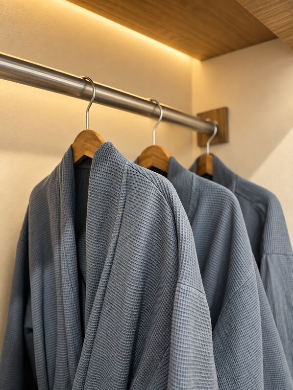 A clothing rack with several garments. - Dawn Boutique Luangprabang Hotel (Luang Prabang)