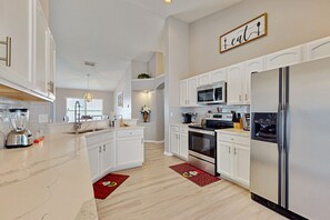Fridge, microwave, oven, stovetop - Charming home with pool, enclosed yard, central AC, & washer/dryer (Davenport)