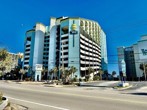 A multi-story parking garage with a sign indicating it is part of the Montyree Hotel. - On top of the world! 1br sleeps 4-6 MB 1629 (Myrtle Beach)