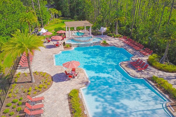 A heated pool - Charming dog-friendly home with pool, hot tub, fitness center, patio, & kitchen (Davenport)
