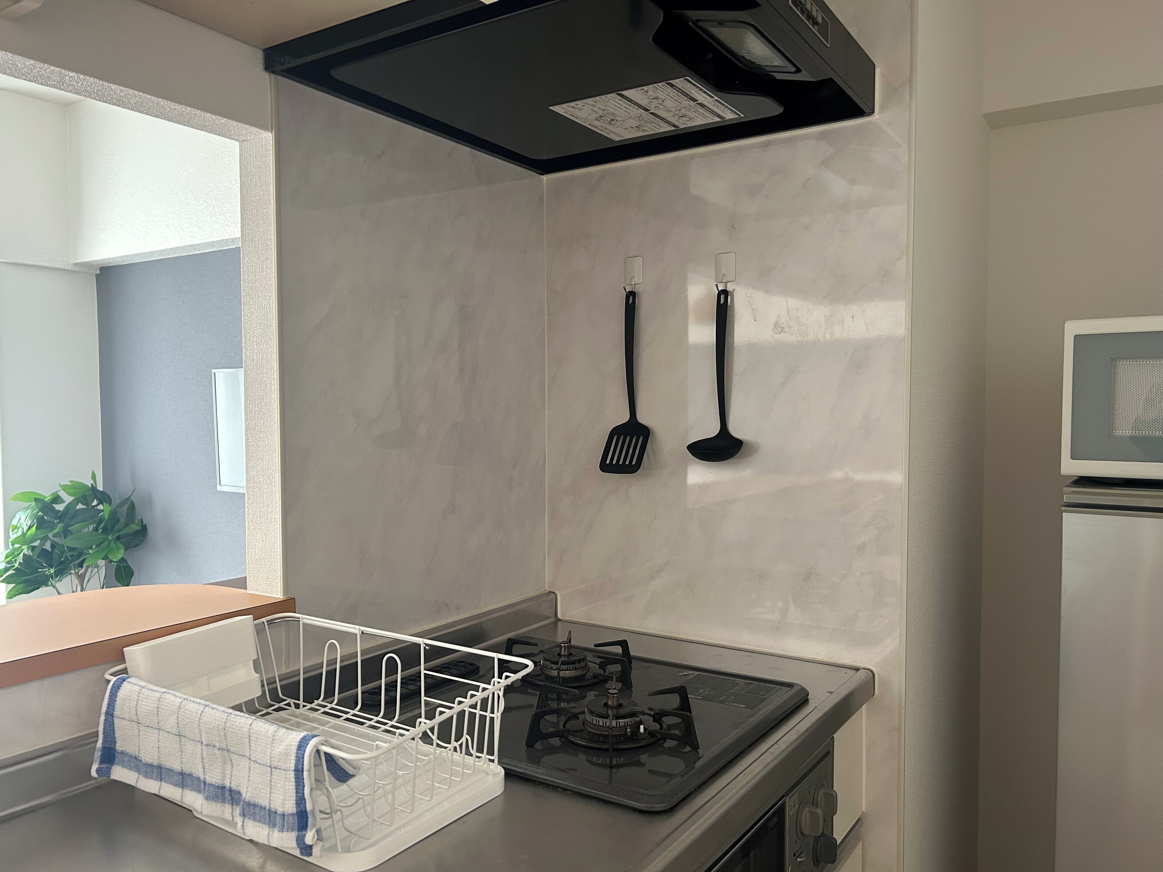 Apartment | Private kitchen | Fridge, microwave, stovetop, cookware/dishes/utensils