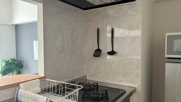 Apartment | Private kitchen | Fridge, microwave, stovetop, cookware/dishes/utensils