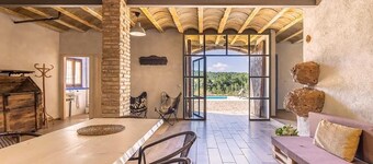 Isolated farmhouse surrounded, vineyards, olive trees and forest