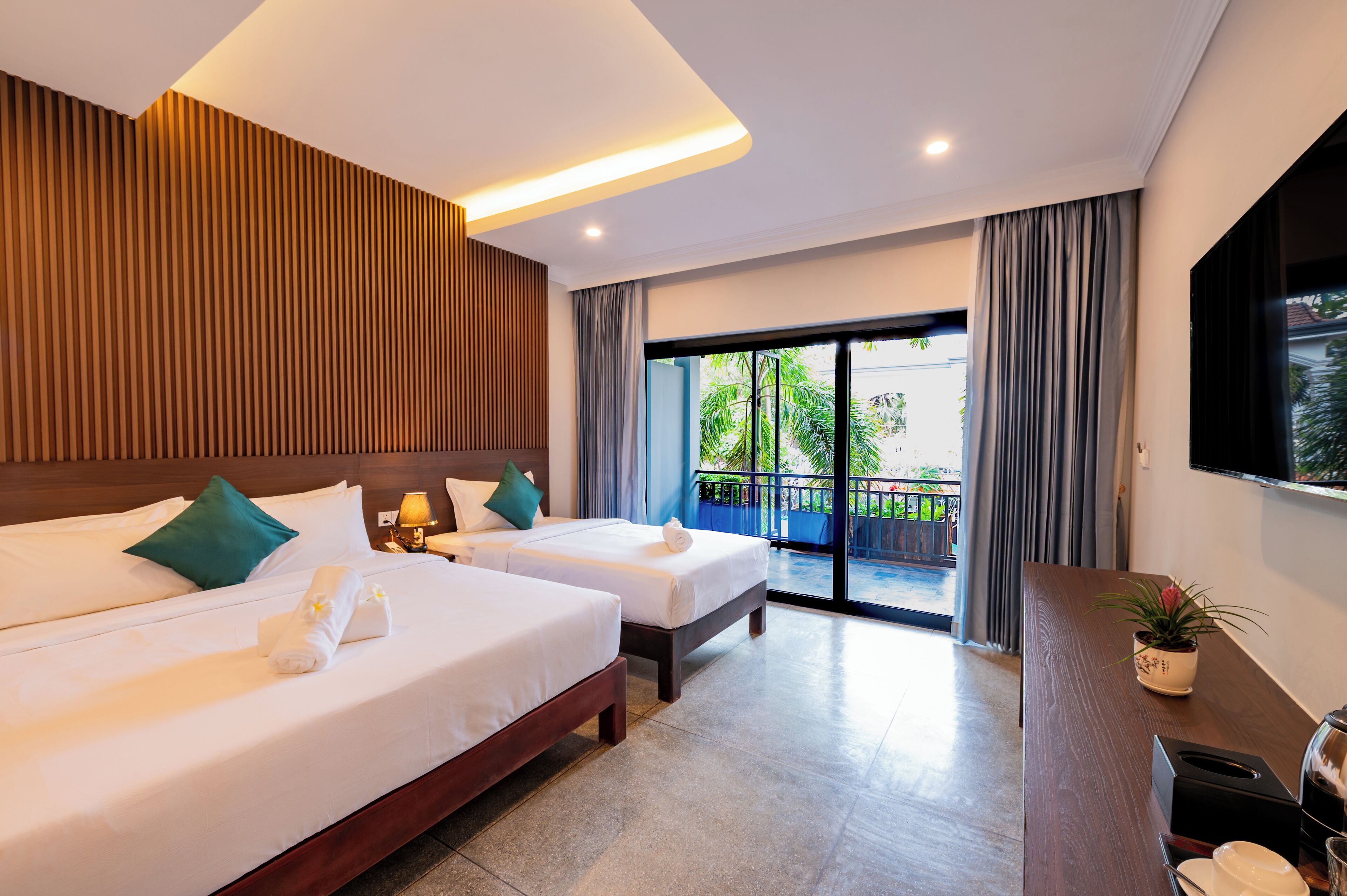 Family Room, Multiple Beds, Air conditioning, Pool View | In-room safe, soundproofing, iron/ironing board, free WiFi