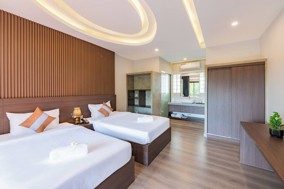 Deluxe Twin Room, Pool View | In-room safe, soundproofing, iron/ironing board, free WiFi