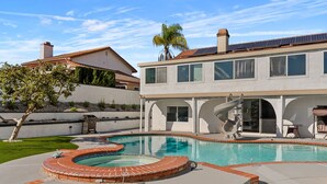 A modern two-story house with a swimming pool, a patio, and a barbecue area. - Relax & Unwind: Pool, Jacuzzi & Private Backyard (Rowland Heights)