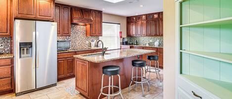 Coffee/tea maker, toaster, cookware/dishes/utensils, dining tables