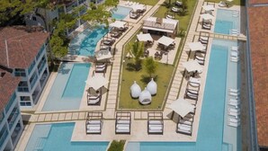 A resort with multiple swimming pools, sun loungers, and a view of the ocean. - Presidencial suite 2 bedroom and kitchen Cabarete (Cabarete)
