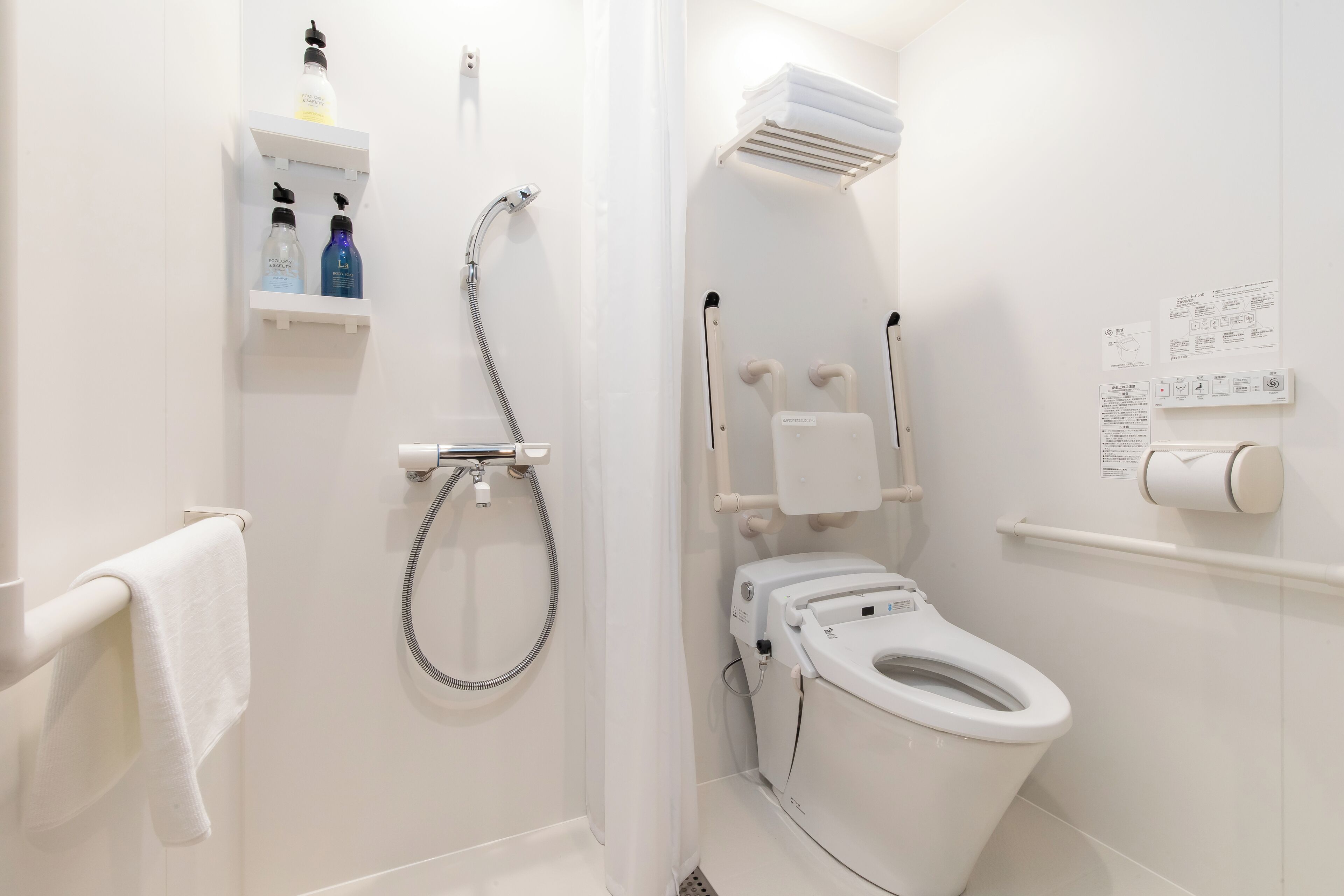 Combined shower/tub, hair dryer, slippers, towels