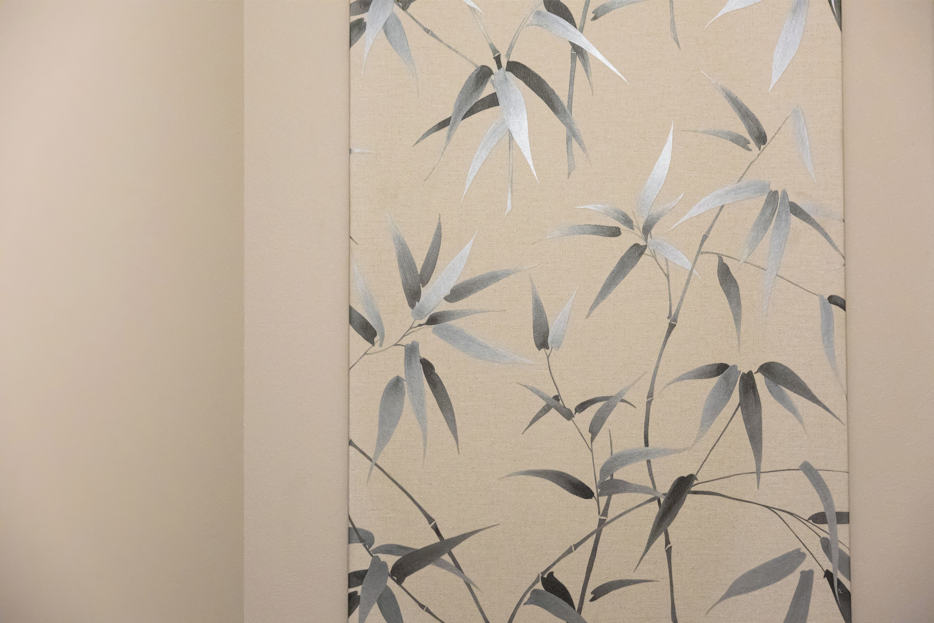 A wall with a bamboo pattern.