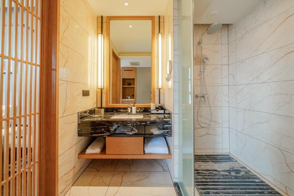 Shower, hair dryer, slippers, towels