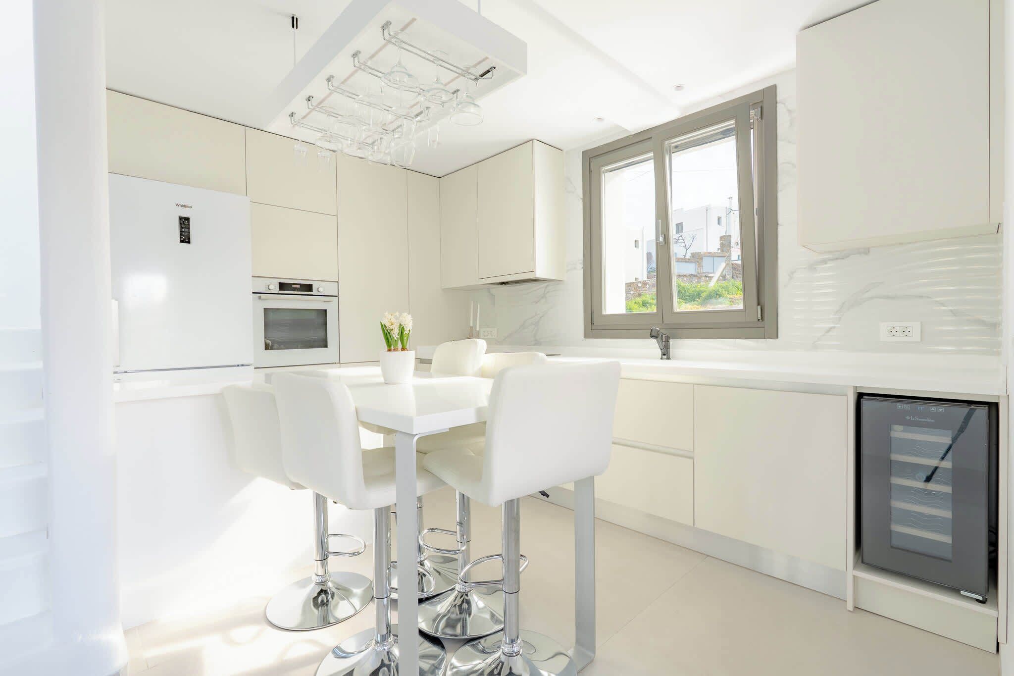 Fridge, stovetop, dishwasher, coffee/tea maker