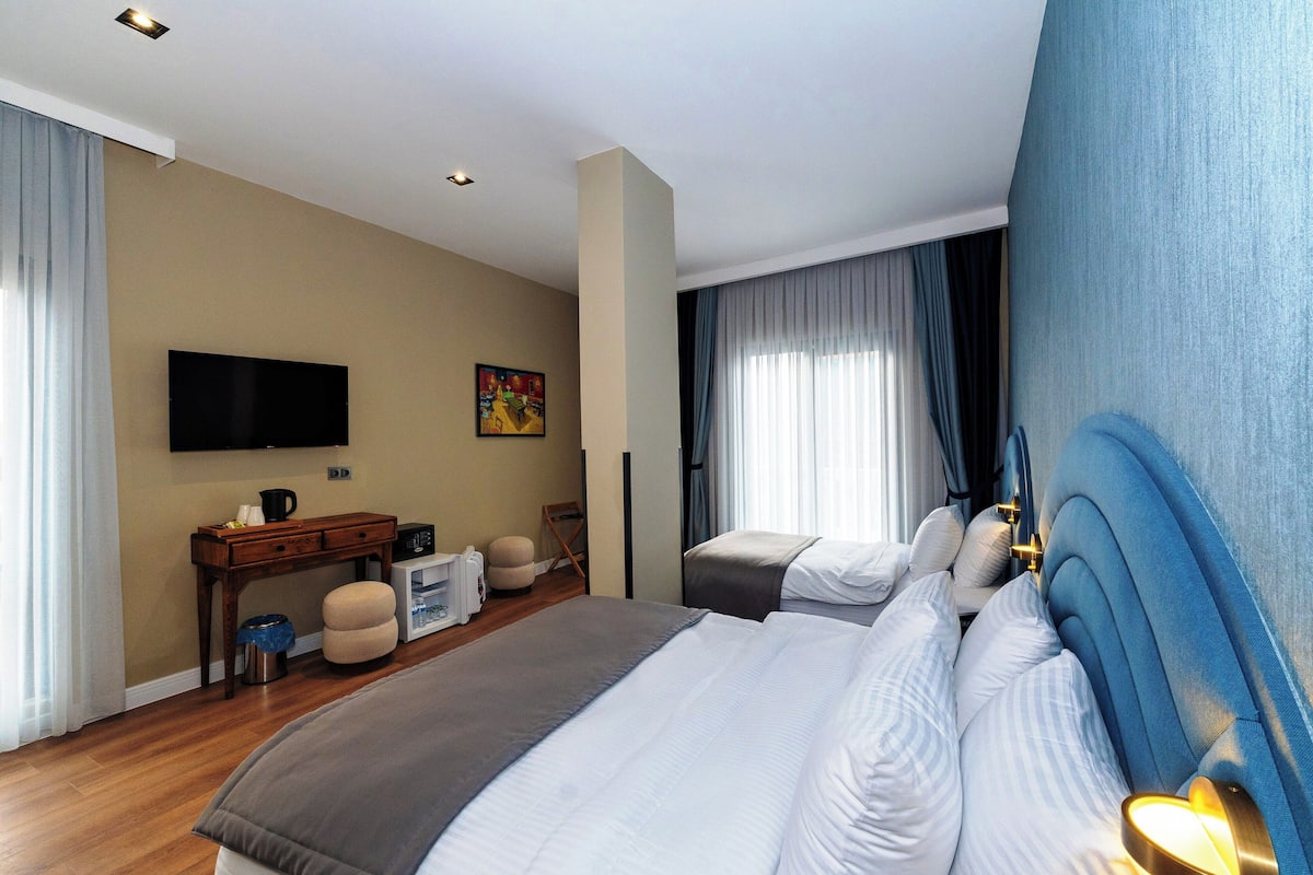 Deluxe Family Balkonlu Oda | Egyptinpuuvillaiset lakanat, ylelliset vuodevaatteet, untuvapeitot