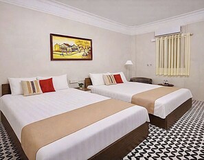 Pillow-top beds, desk, free WiFi, bed sheets