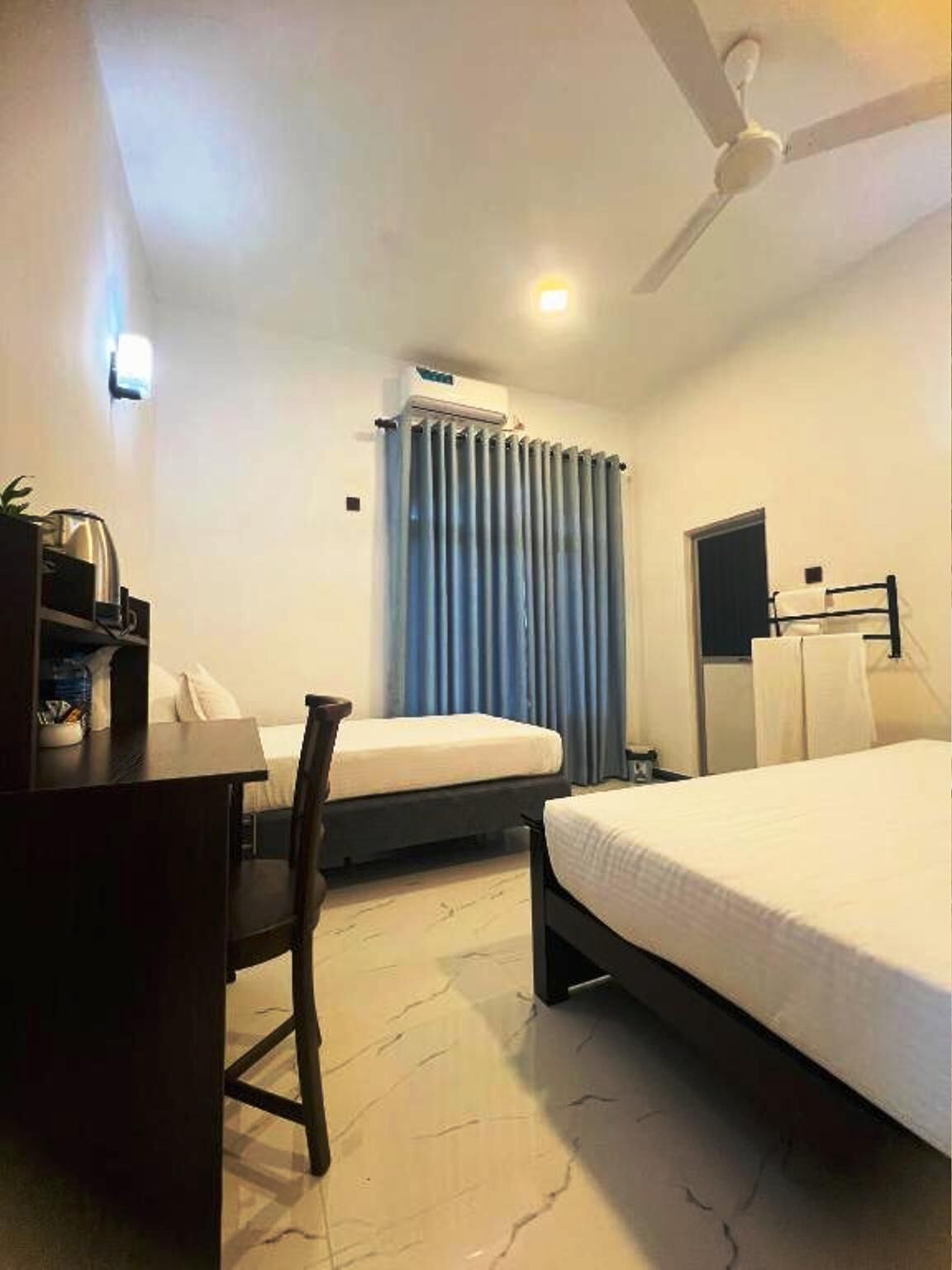 Comfort Triple Room, Garden View | In-room safe, desk, laptop workspace, soundproofing