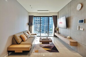 Luxury Apartment, 2 Bedrooms, Balcony, City View | Living area | 55-inch Smart TV with digital channels - LaLa The Opera Central City Residence (Thu Duc)
