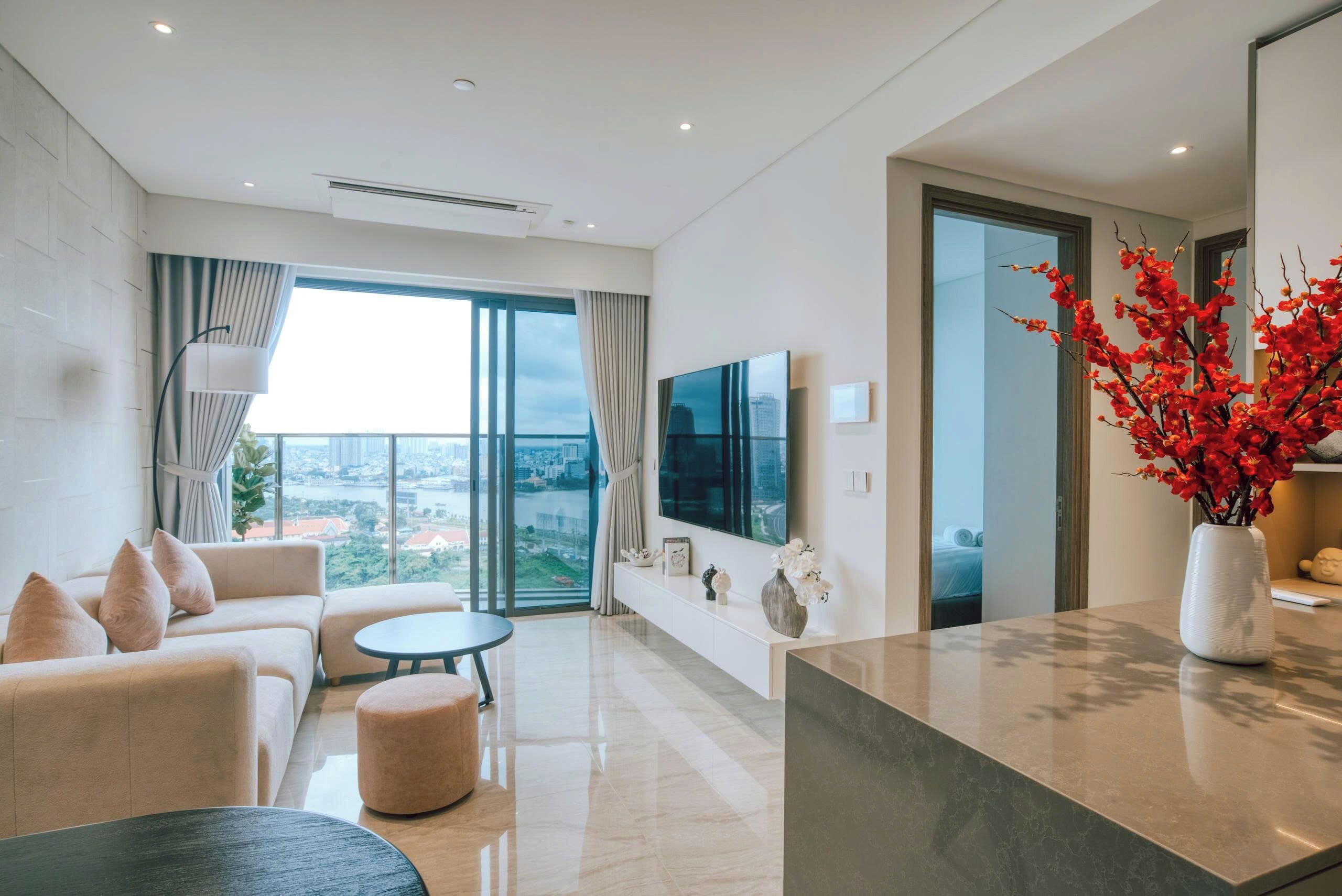 Deluxe Apartment, 1 Bedroom, Balcony, City View | Living area | 55-inch Smart TV with digital channels