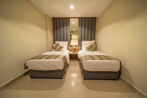 In-room safe, desk, laptop workspace, iron/ironing board - Continent Resort Al Uqayr (Al Uqayr)