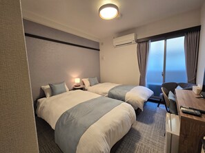 Habitación básica con 2 camas individuales, 2 camas individuales | Escritorio y wifi gratis