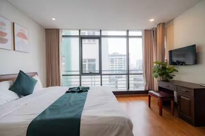 Deluxe Studio, 2 Queen Beds, Bathtub, City View | Free minibar, desk, laptop workspace, iron/ironing board - Sakamoto 1 Apartments by XÔI Residences (Giang Vo)