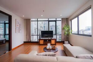 Deluxe Studio, 2 Queen Beds, Bathtub, City View | Living area - Sakamoto 1 Apartments by XÔI Residences (Giang Vo)