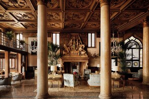 A grand interior with high ceilings, ornate columns, and classical sculptures. - Danieli, A Four Seasons Hotel, Venice (Venice)