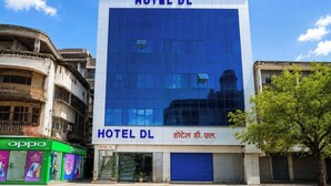 A modern hotel building with a blue facade and the name 'HOTEL DL' prominently displayed. - Hotel DL (Tezpur)
