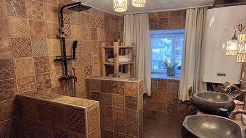 Shower, towels, soap, toilet paper