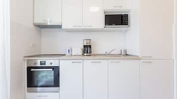 Premium Penthouse, Courtyard View | Private kitchen | Fridge, microwave