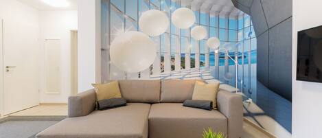 Premium Penthouse, Courtyard View | Living area | Flat-screen TV