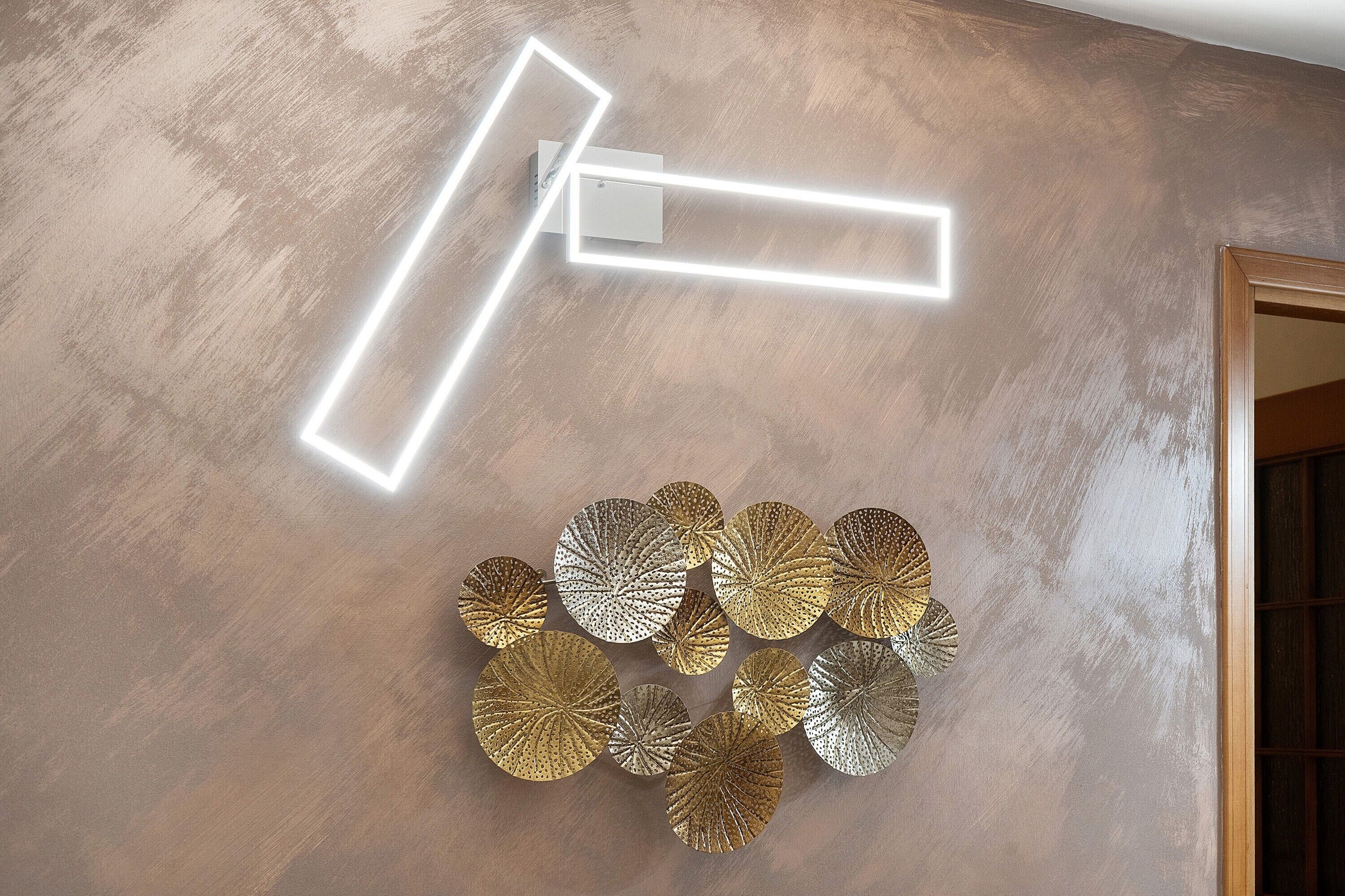 A wall with a textured finish and a geometric light fixture.