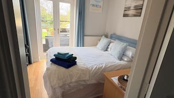 1 bedroom, desk, iron/ironing board, travel crib