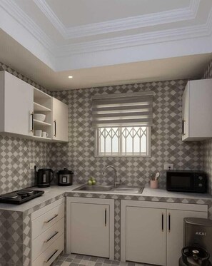 Habitación Deluxe, vista a la ciudad | Cocina privada | Refrigerador con congelador, microondas y lavavajillas 