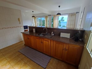 Fridge, microwave, oven, coffee/tea maker - Madeira, 2 Bedroom house with sea view and Penha de Águia, Porto da Cruz, Madeira Island (Porto da Cruz)
