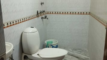 Economy Single Room, City View | Bathroom | Shower, towels, soap, shampoo