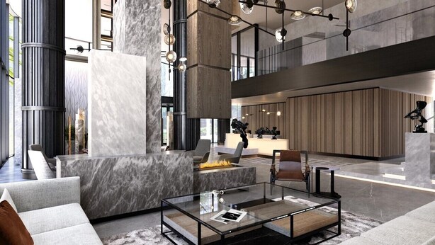 A modern lobby with a fireplace, seating area, and a kitchen in the background. - ART Riverfront Hotel Tbilisi (Tbilisi)