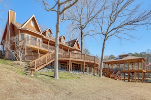 A large wooden house with multiple balconies and a covered porch. - 2-tier Dock w/ Lift! Jordan Lake Family Retreat (Titus)