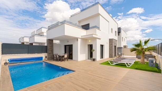 A modern two-story house with a swimming pool, outdoor seating, and a well-maintained lawn. - Casa Montgavina, villa in the heart of Vistabella Golf (Entrenaranjos)