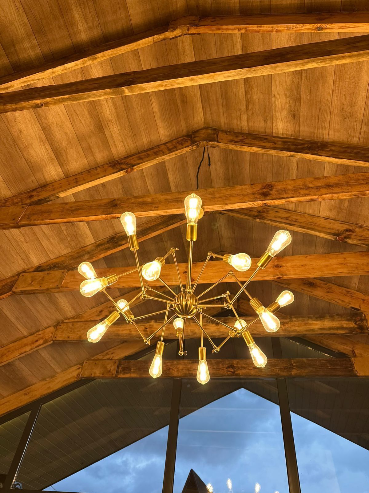A wooden ceiling with a central light fixture.
