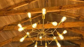 A wooden ceiling with a central light fixture.