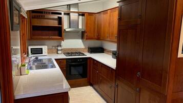Fridge, microwave, toaster, cookware/dishes/utensils