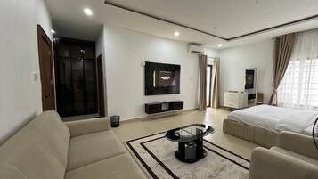 Deluxe Room, Balcony, City View | In-room safe, desk, laptop workspace, blackout curtains