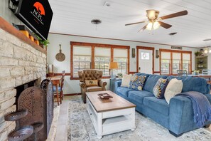 TV, fireplace - Blue Haven Bungalow | Walk to Cypress Falls, Fire Pit & Fenced Yard (Wimberley)