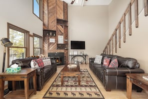 Televisión, chimenea, reproductor de DVD, futbolito