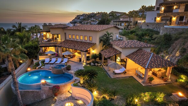 A luxurious villa with a swimming pool, outdoor seating, and a well-maintained garden. - Oceanview Villa by Swimming Beach w/ Pool, Hot Tub, Firepit, Cook & Beach Club (Cabo San Lucas)