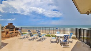 Outdoor dining - Feel the Sea Breeze, Stylish 2 BR Condo on the Beach W/ Pool (Daytona Beach)