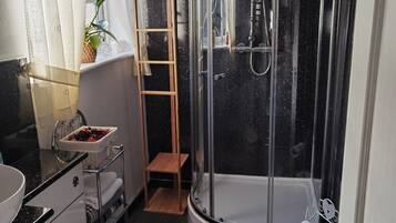 Shower, hair dryer, towels, soap