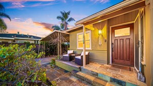 A house with a porch, a door, and a number '1928' on the wall. - Mins To Beach W/ Jacuzzi, Large Yard,Parking & AC! (Oceanside)