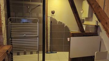 Shower, hair dryer, towels, toilet paper